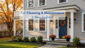 North American style home decorated for fall with seasonal plants and a wreath, representing fall cleaning and maintenance in New England.