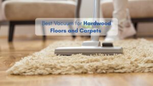 Person vacuuming a beige carpet in an American-style living room with hardwood floors.