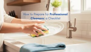 A woman washing dishes in a bright, clean and organized kitchen, representing preparation for professional home cleaning.