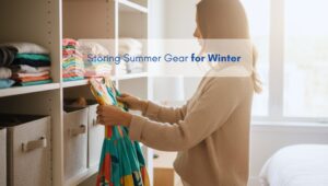 Woman organizing and folding colorful summer clothes in a clean, bright bedroom closet of a North American-style home, illustrating how to store summer gear for winter.